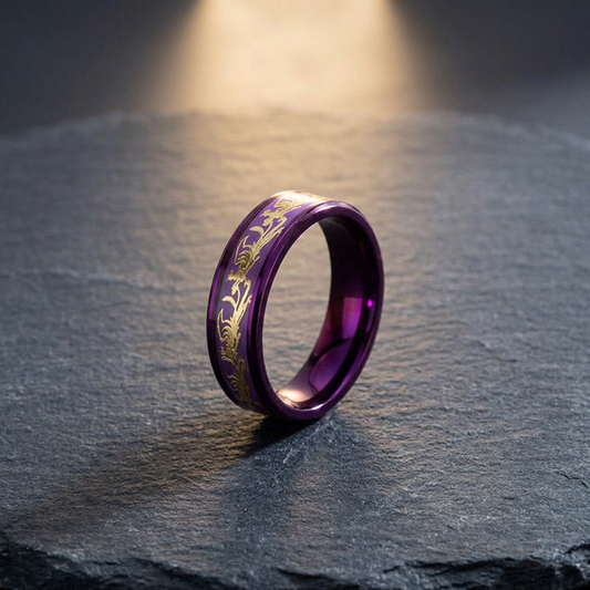 Gothic purple titanium ring with gold phoenix engraving, side view on dark slate surface with dramatic spotlight lighting — dark aesthetic alt fashion jewelry — Shadow Realm Supply